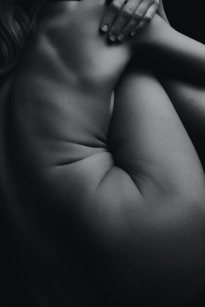 naked woman in black in white