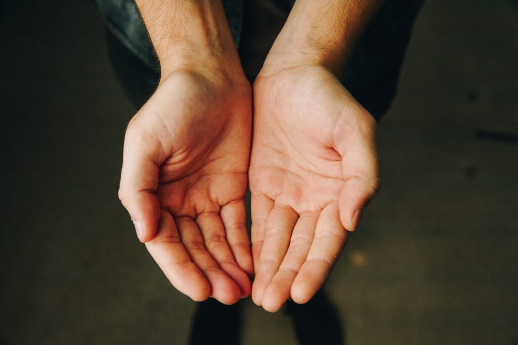 hands are open and reaching out to the viewer