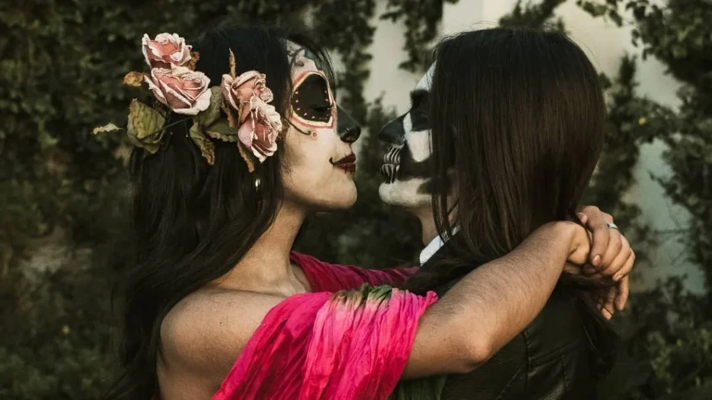 girl couple kissing in a halloween setting for a cute couple photo