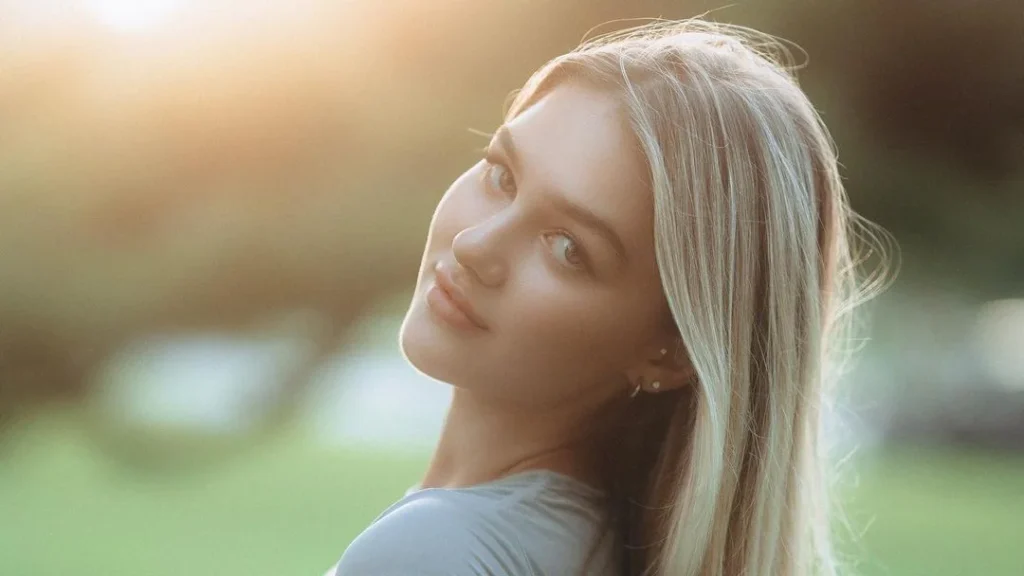 beautiful blonde girl looking back to look at the camera as a type of portrait photography