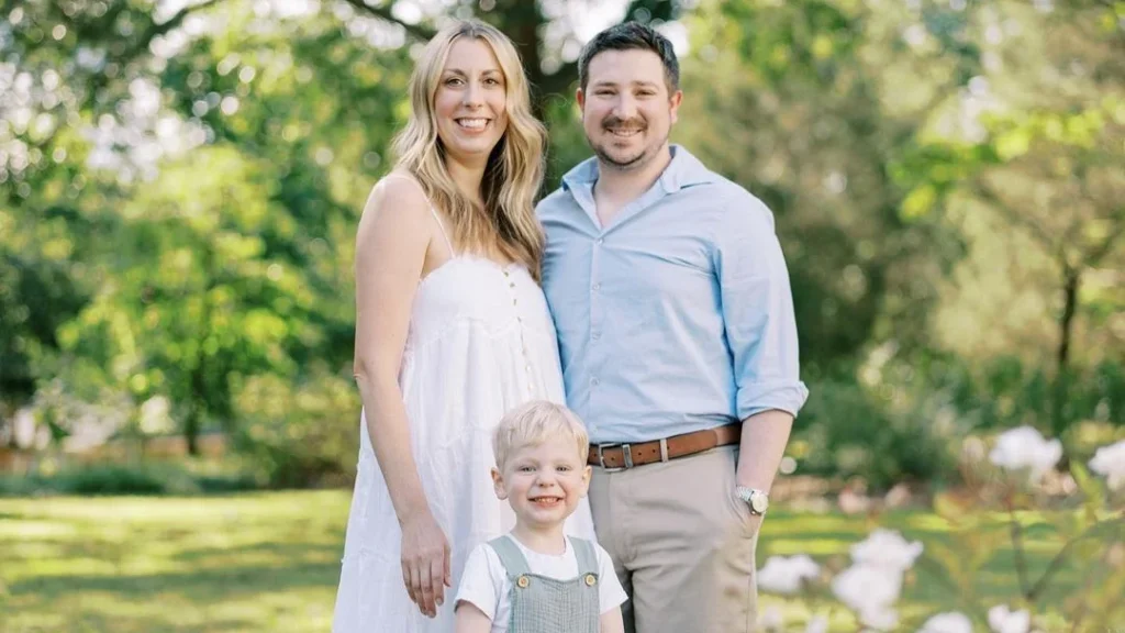 happy family doing a family portrait in spring, beautiful spring trees for a family photo, blonde woman